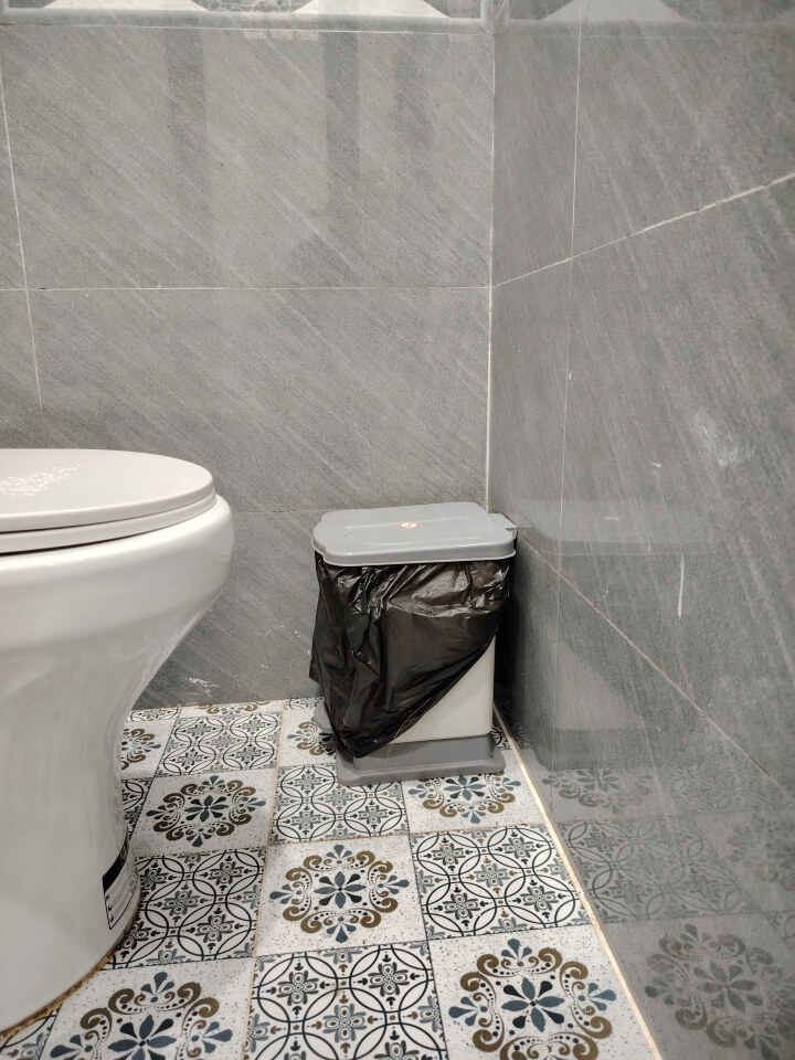 Trash bin in toilet